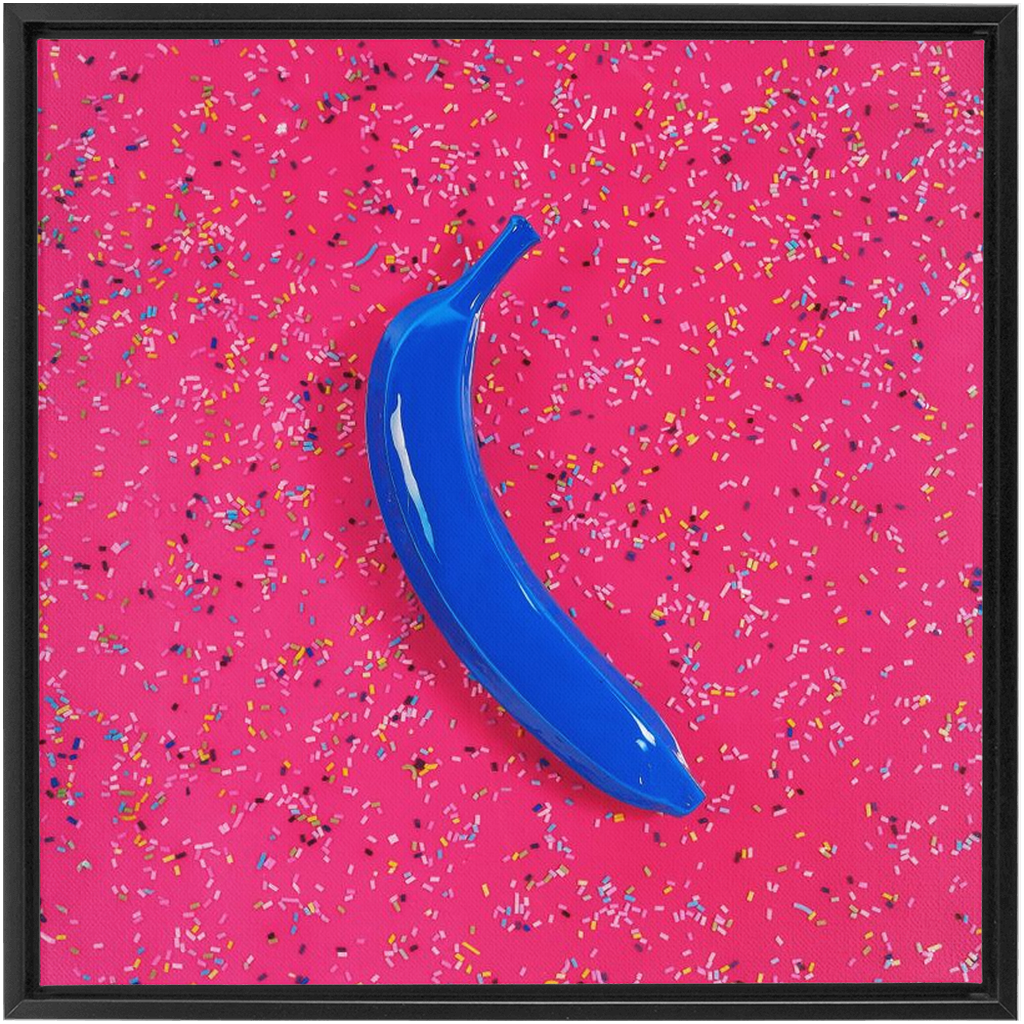 Canvas Print: "Blue banana on pink with sprinkles"