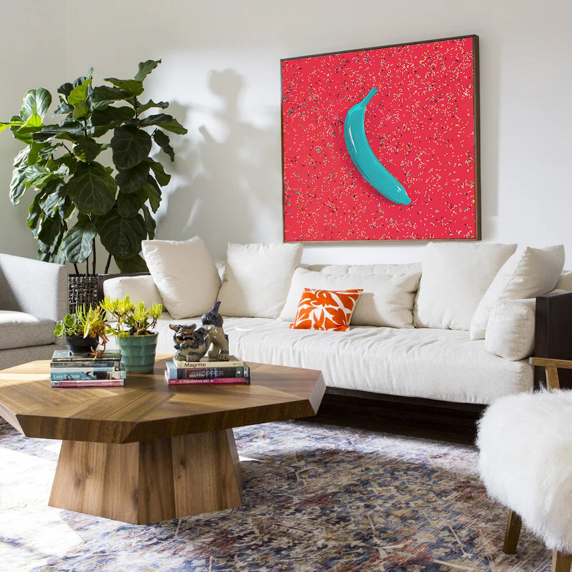 Canvas Print: "Blue banana on orange with sprinkles"